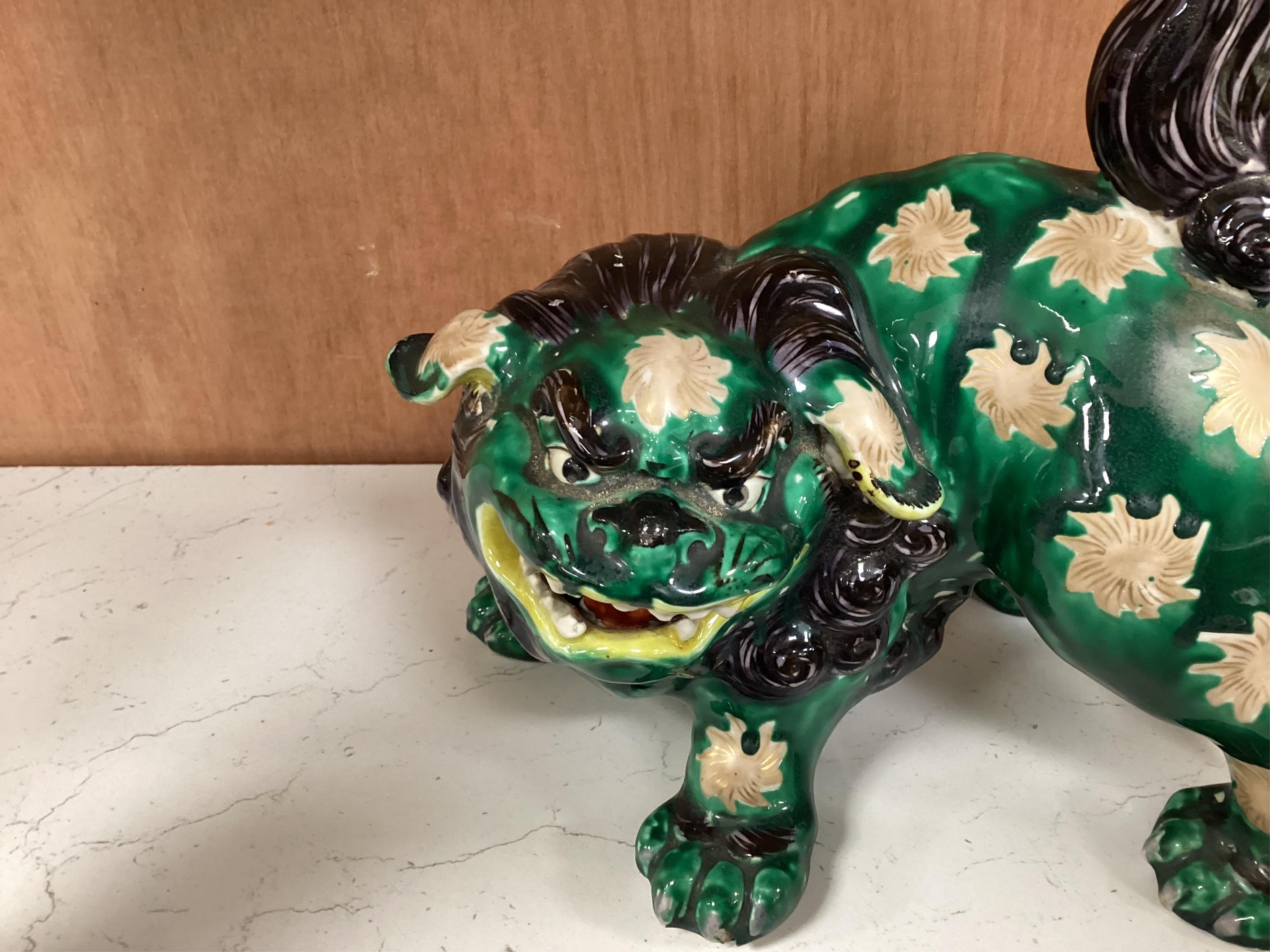 A Japanese Dog of Fo, a box and cover figure and blue and white pourer, Dog of Fo, 25cm high